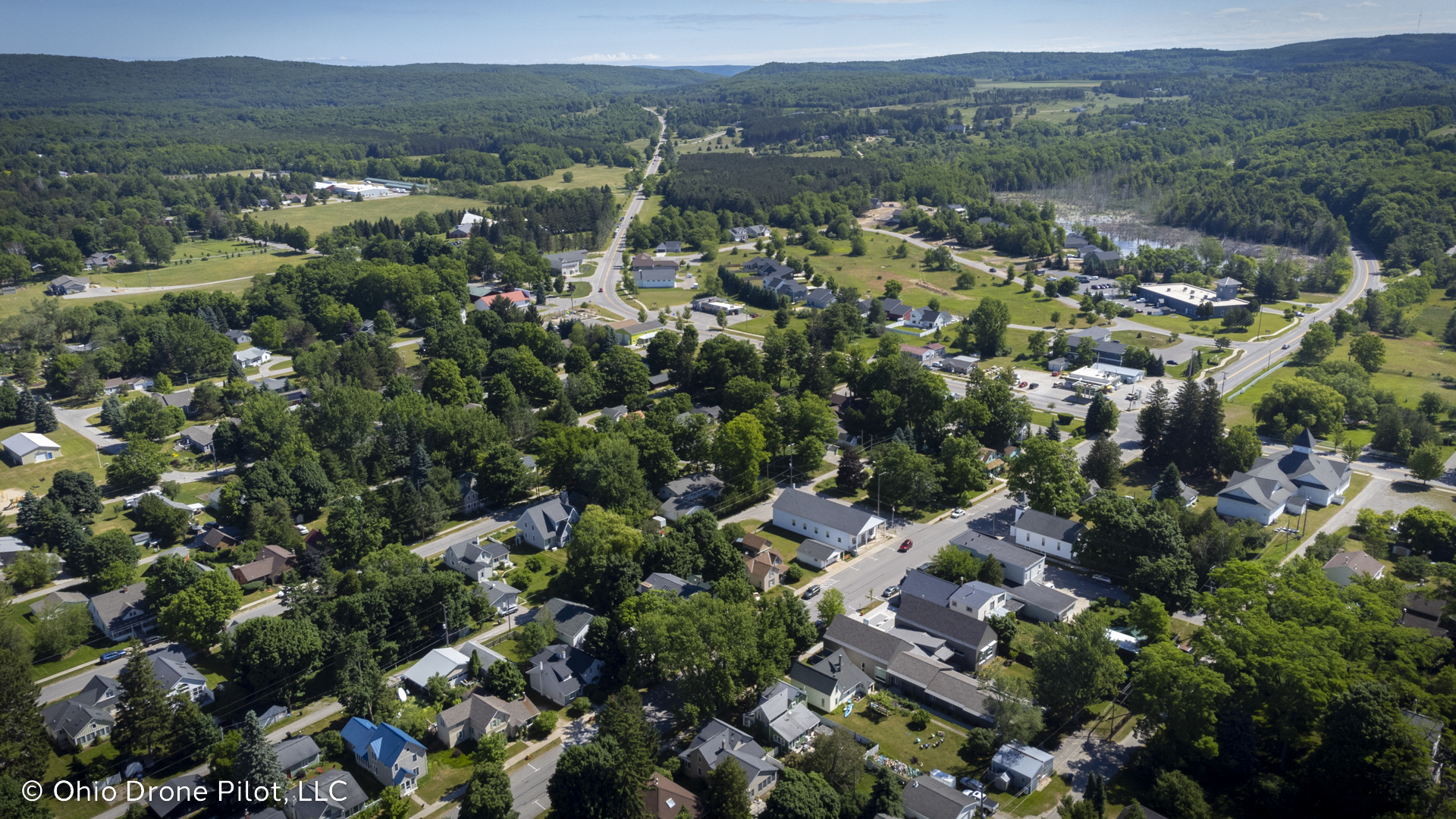 Aerial view over Empire, Michigan with Route 22 leading off into the distance