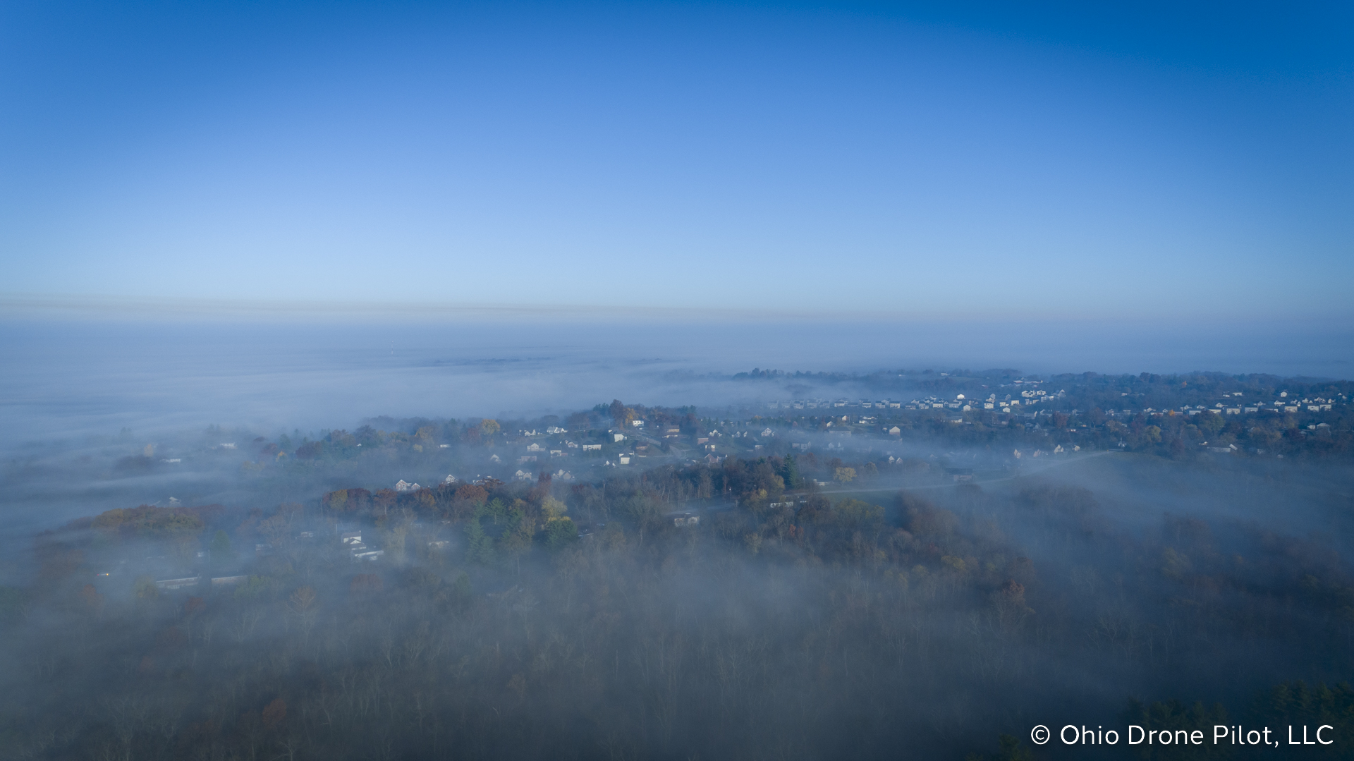 Aerial overview of a Colerain neighborhood, shrouded in fog