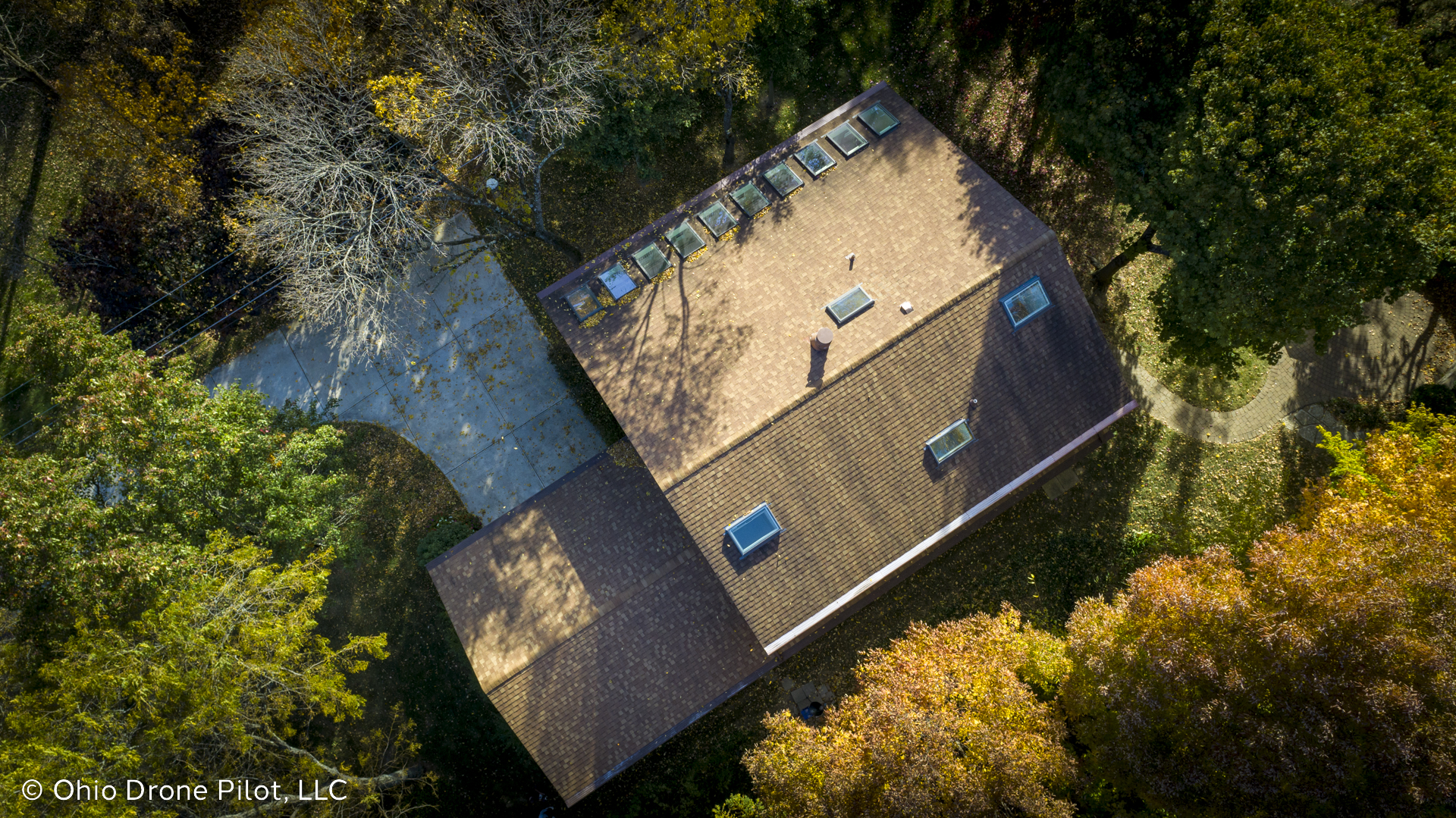 Looking down at a roof with many skylights