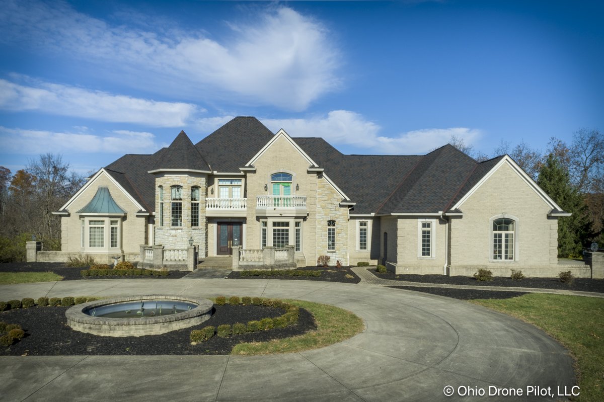 Front of a large, beautiful home with a newly installed roof