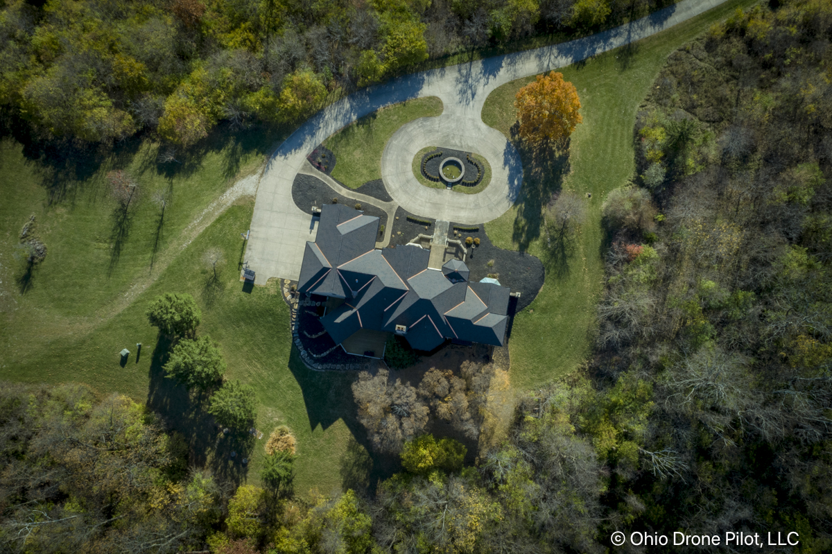 High aerial photo of a large home and the surrounding lands