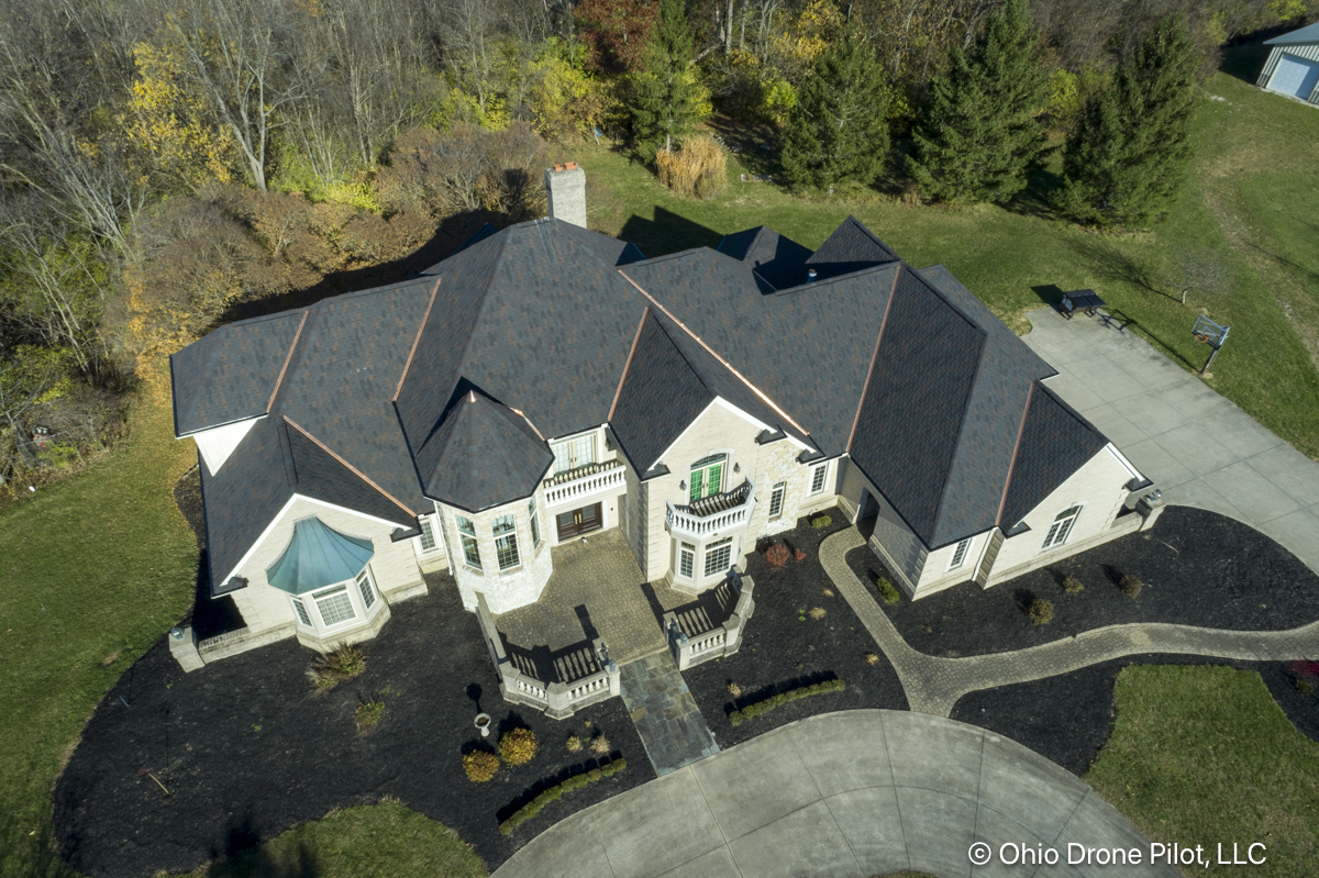 Aerial photo of an intricate roof and its newly installed tiles